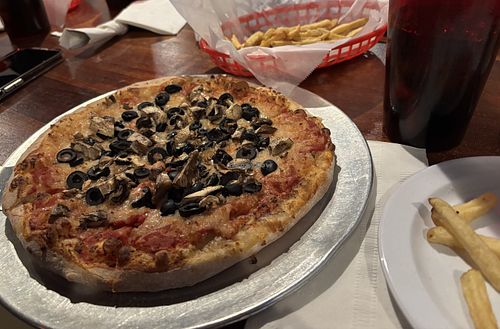 10-inch pizza with vegan cheese, mushrooms, and black olives; French fries   at UnCommon Pizza in Lititz