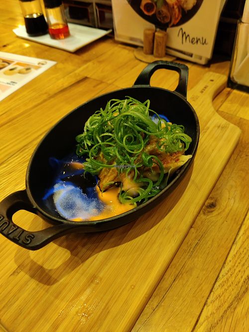 Burning onion dumplings at Isogami Gyoza Bar Tomako in Kobe