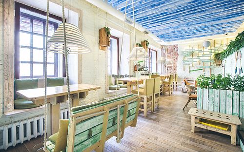 Vegetarian café “Ukrop”-Summer

The interior of “Ukrop Summer” at 14th Malaya Konushennaya St., ambience is inspired by a summer house. There are even real swings that remind the pleasant summer time.  at Cafe Ukrop II in St Petersburg