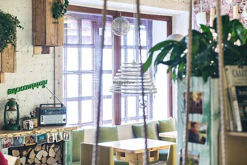 'Vegetarian café “Ukrop”-Summer The interior of “Ukrop Summer” at 14th Malaya Konushennaya St., ambience is inspired by a summer house. There are even real swings that remind the pleasant summer time. ' at Cafe Ukrop II in St Petersburg