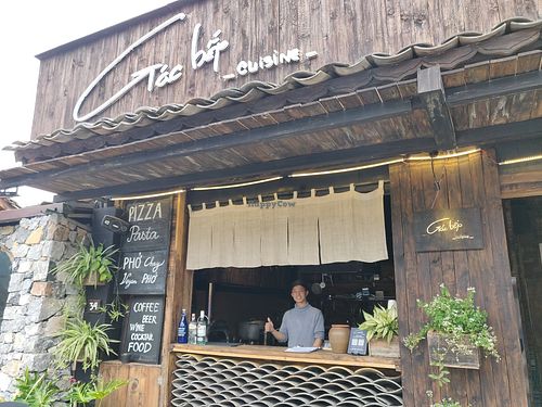 Entrance and chef at Gác Bếp Cuisine - Food & Drink in Dong Van