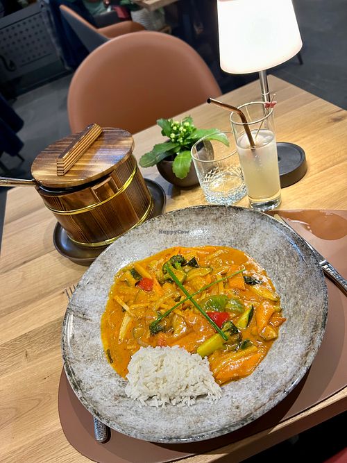 Vegetables in yellow, red, or green curry with coconut milk served with rice at KO LANTA in Namur