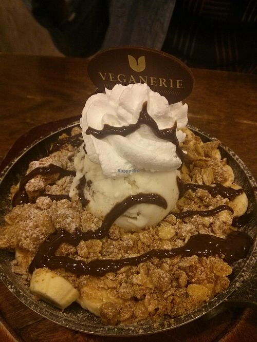Warm cookie covered in fruit, ice cream, whipped cream, and drizzled with chocolate. All vegan. at Veganerie - Mercury Ville in Bangkok