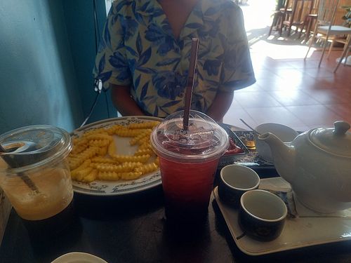 Iced macchiato, French fries, blueberry soda, tea at Honney Cafe & Slow Bar in Phonsavan