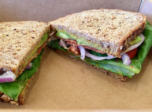 Vegan bacon,  lettuce, tomato sandwich on Dave's bread. at The Living Root Cafe in Redlands