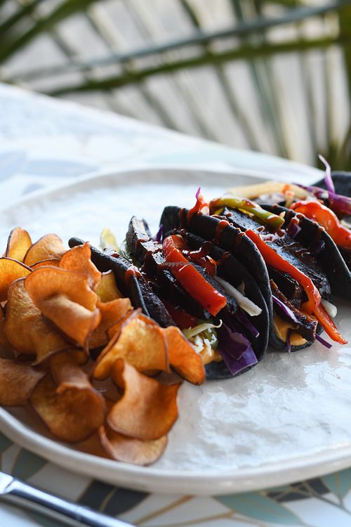 Black Taquitos ~ de seitan salteado con morrones, zanahorias y cebolla. at Nicolita Cocina Veggie in Buenos Aires