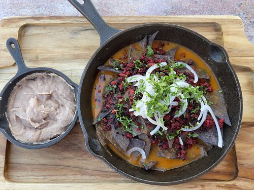 Chilaquiles con frijoles ha el lado. at Lupe 87 in Villa De Juarez