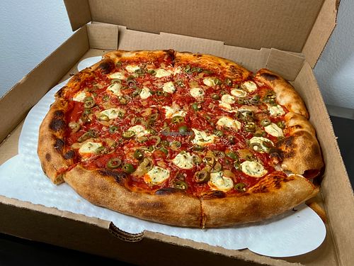 byo vegan pizza w/garlic confit + pickled serrano + Castelvetrano olives at Dantini Pizza in Seattle