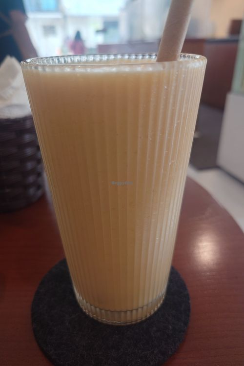 Mango pineapple orange smoothie without yogurt and with oat milk at Dream Beans Coffee Roastery in Hanoi