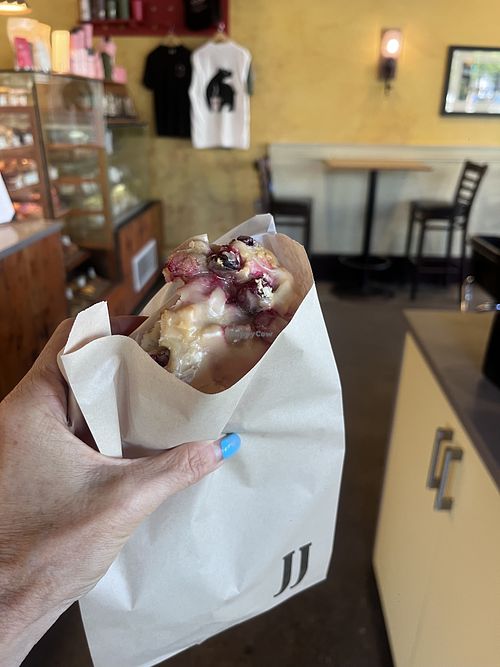 Vegan raspberry scone with maple glaze   at JJ Bean Coffee Roasters  in Vancouver
