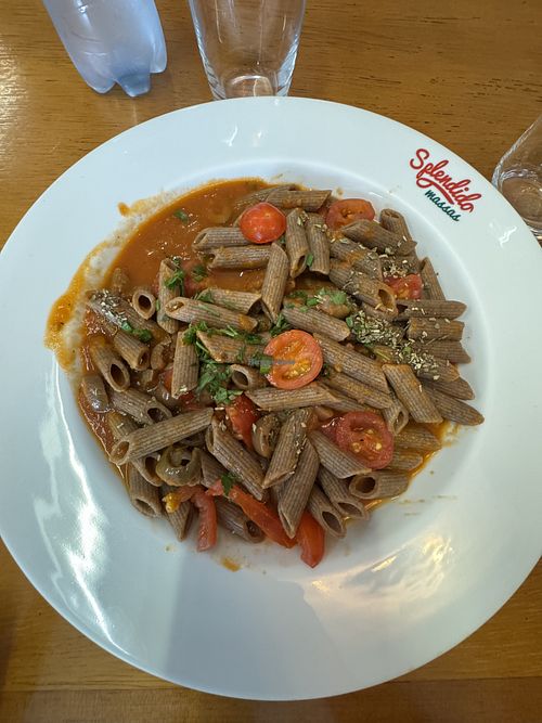 Whole wheat penne with tomato sauce, olives, and grape tomatoes.  at Splendido Massas in Arcos