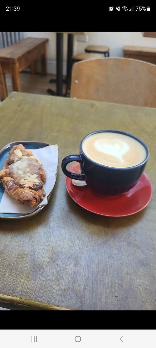 Yummy almond and raspberry vegan croissant and oat cappuccino at One Shot Coffee in North West London