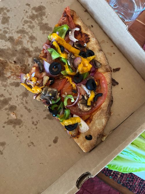 Harvest moon with vegan cheese and no garlic butter brushed crust. GF crust is also vegan    at Blue Moon Bakery in Big Sky