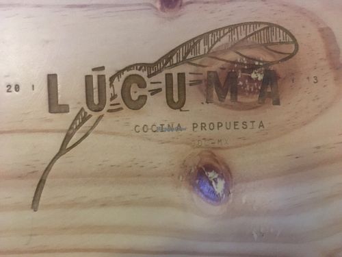 The beautiful branding on the woodsy new table and chair sets. at Lucuma in Guadalajara