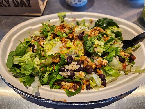 Burrito bowl: brown rice, black beans, sofritas, hot sauce, guacamole and lettuce at Chipotle in Redding
