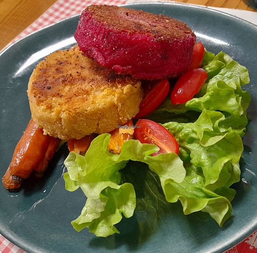 Chickpea and beetroot burgers with salad. at Osteria 33 in Piazza