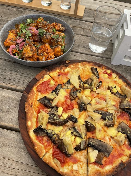 Cauliflower bites are vegan and there are a few vegetarian pizzas which can be swapped with vegan cheese. The fungi pizza was delicious!   at Phat House Brewing in Haruru
