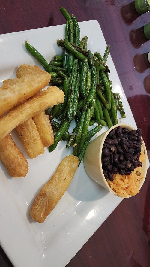 Sides of fried yucca, green beans, rice and beans. at Don Lucho in Ashland