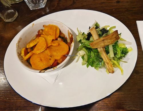 Main: Spicy butterbean, red pepper and smoky tomato hotpot, with wilted greens and roast parsnips at The Bull's Head in Macclesfield