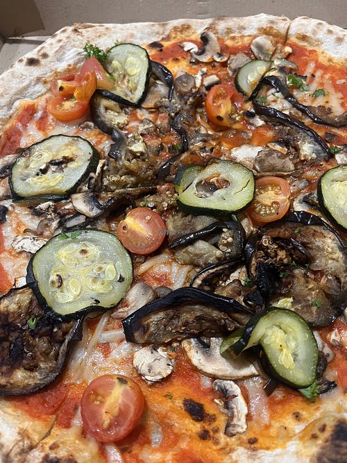 Veg pizza made vegan by swapping to vegan cheese for an extra $4  at The Beach House  in Trinity Beach