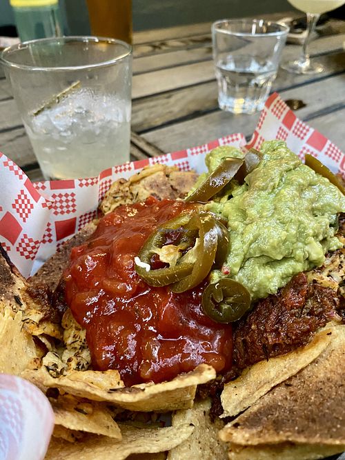 Vegan oven-baked nachos with vegan carne, vegan cheese, salsa and guacamole. Mango margarita.  at The Warren View Hotel in Enmore