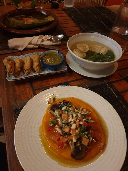 Cauliflower Steak on pumpkin puree, samosas, wonton soup, grilled tofu in banana leaf at NAGA Restaurant in Gili Asahan