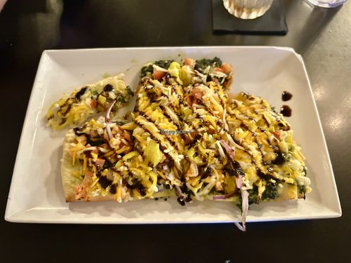 Mediterranean flatbread, minus olives, plus banana peppers. The basil spread and balsamic glaze are a great combo. Very fresh and satisfying    at TRIO in Goodrich