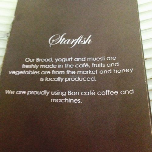 front of menu at Starfish Cafe in Sihanoukville