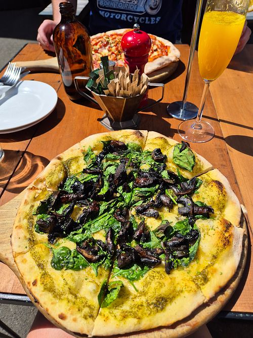 Vegan option of the Bannockburn pizza, plus mimosa at Vogel St Kitchen in Dunedin