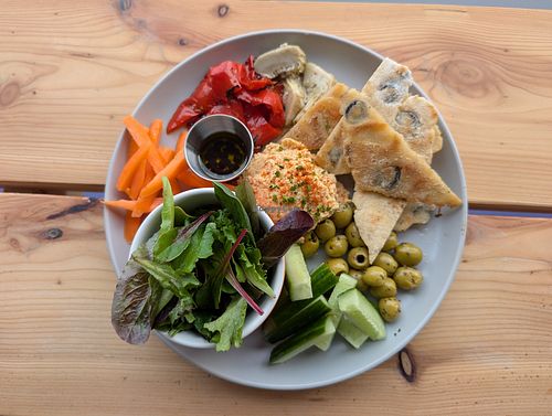 Mediterranean plate with homemade olive flatbread, homemade sesame-free houmous and antipasti at Peas and Libertea in Whitley Bay