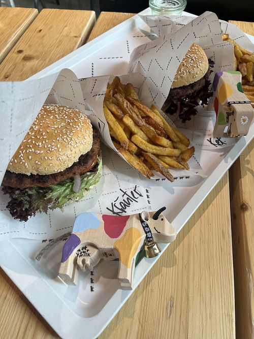 Vegan Burger 🌱 (with self-painted cow, the ears are made of fake leather)   at Rosa's Bakery & Bistro in Brienz
