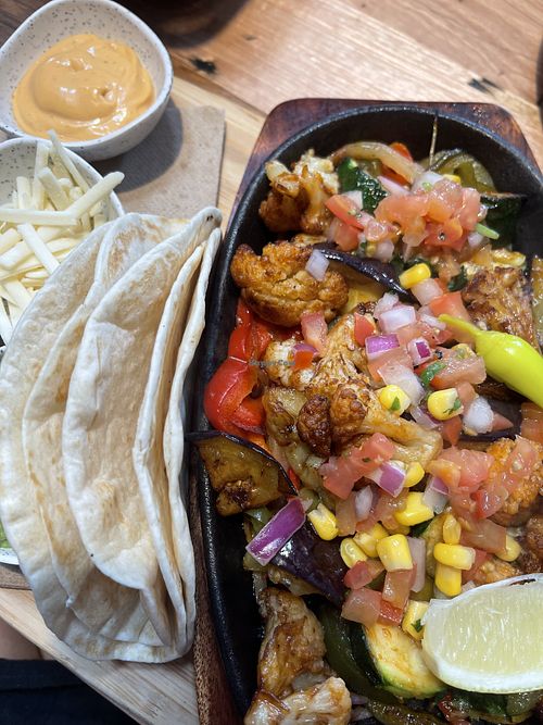 Veggie Fajitas (eggplant and cauliflower) and other veggies. Plus vegan cheese, vegan spicy mayo and guacamole.   at La Cabra Mexican in Mordialloc