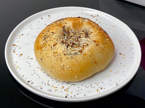 white onion + poppy bialy (plated at home) at Hey Bagel  in Seattle