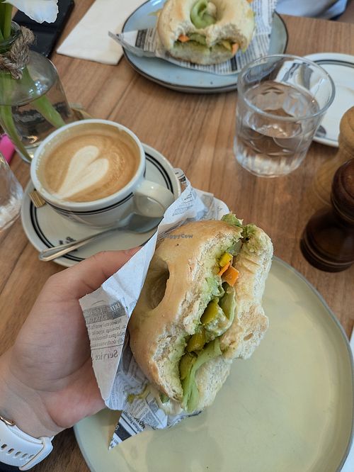 Vegan bagel with hummus, avocado and vegetables & cappuccino with oat milk at PIJAT in Vienna