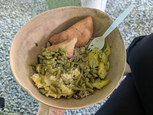 Lunch bowl: mashed ground provisions, okra brown rice cooked in coconut, green beans, star fruit salad, and fry bakes. at YARD FOOD in Buccoo