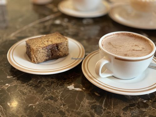 Keke de plátano with Hot chocolate (made with soya milk)  at Pasteleria San Antonio in Lima