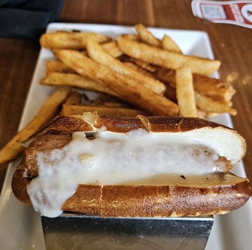 Beyond Vegan Brat (with vegan cheese but no vegan slaw because they were out). Brat was good. Fries were excellent. BBQ Sauce is not vegan here (they add milk stout to it). at DTW - Atwater Brewery - Gate D24, Concourse D in Detroit