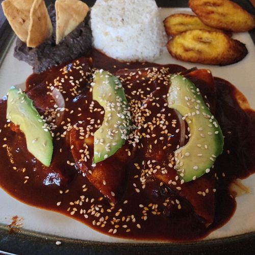 enmoladas with rice, plantains and beans  at Te Quiero Verde in San Cristobal De Las Casas