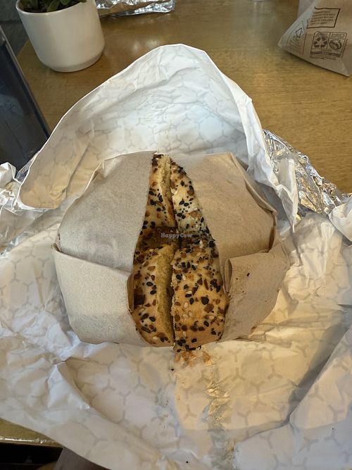 Vegan breakfast sandwich with everything bagel and vegan scallion cream cheesee  at Goldstein's Bagels & Bialys in Boise
