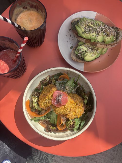 Mediterranean loaded toast, veg juices and sweetcorn fritter nourish bowl with peanut sauce   at Shoots Juice Cafe in Devizes