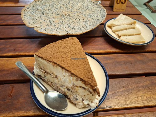 Tiramisu and behind the cracker with cheese on the right at Chickpea Eatery in Da Nang