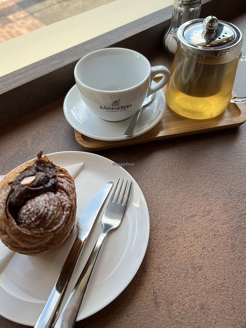 Chocolate hazelnut krafin and pineapple and peach tea 🧡  at Kávafaktura  in Prague