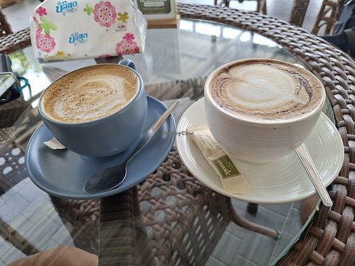 Cappuccino with almond milk (left) and oat milk (right) at Kamkhong Home Cafe in Thakhek