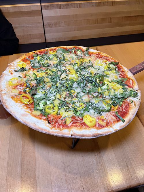 Vegan banana pepper, jalapenos, pineapple, spinach, basil pizza with vegan cheesee  at Graffiti Pizza  in Pensacola