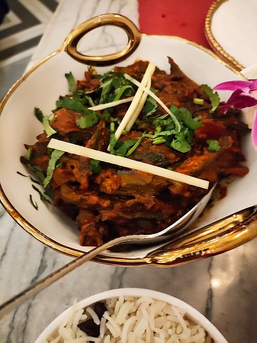 My partner loves okra, ordered Bhindi Masala entree spicy comes with rice, he was happy but couldn't finish portions are huge! at Red Chilli  in Jackson Heights