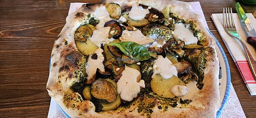 Pizza Toscana with vegan cheese at Pizzium - Trieste in Trieste