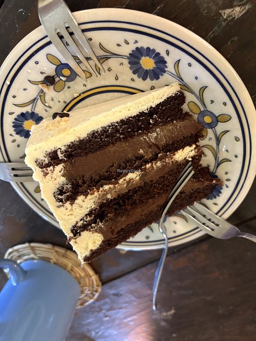 Layered chocolate cake with dulche de leche made from dates and peanut frosting💗 at Amalgamar in Chonchi