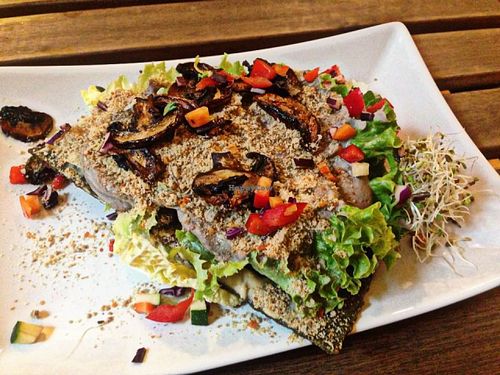 Raw pizza from the daily menu. With a spirulina crust, a mushroom cream loads of raw vegs. Incredibly tasty at Rawcha in Prague