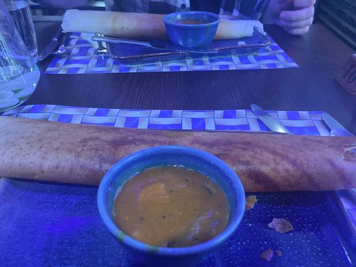 Dosa (pancake) and it's pot of sauce at Bites of India Botanic in Belfast