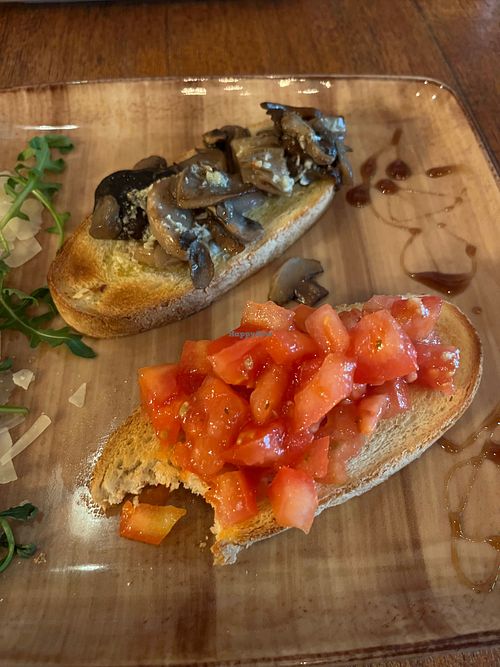 One bruscetta with tomato and one with mushrooms. These are two different starters but I shared with my friend. at La Margherita in Diest
